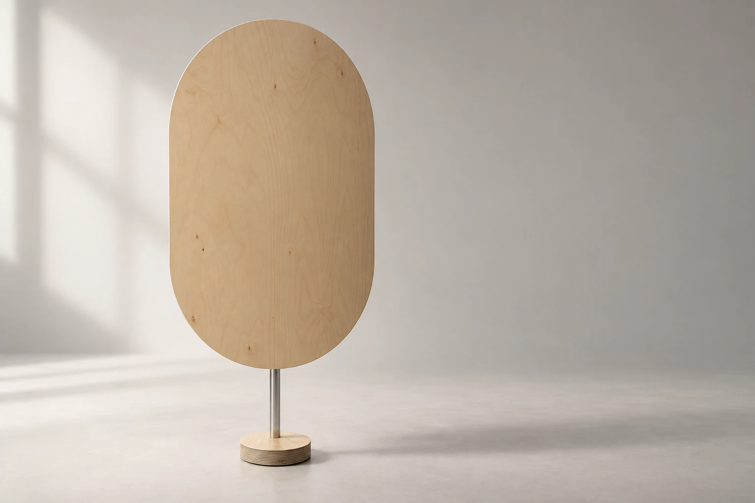 An oval birch panel speaker on a slender metal stand and circular wooden foot